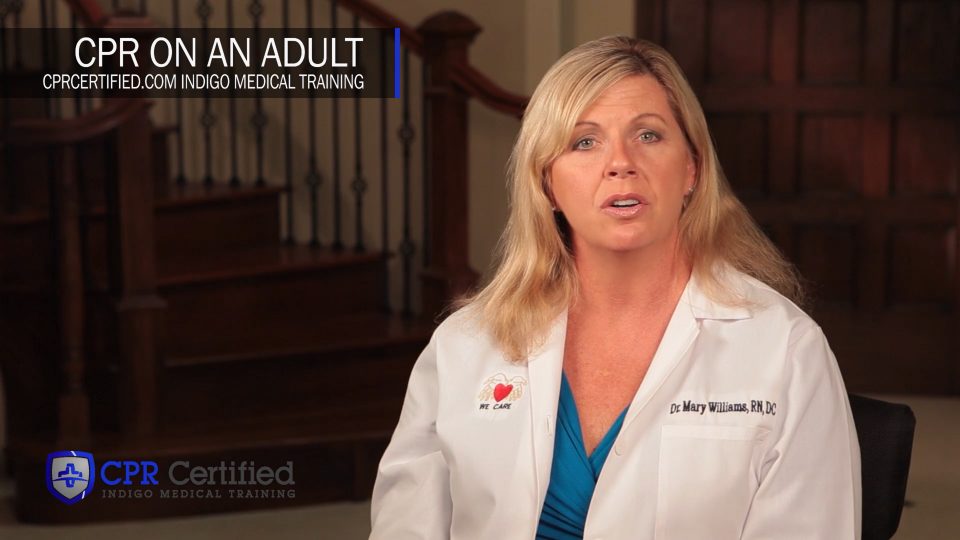 Instructor Dr. Mary Williams demonstrating CPR on an adult in a CPR Certified training video